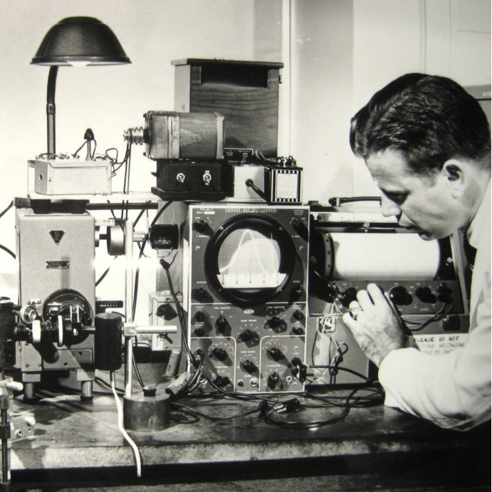 Photo of Dr Bowman in the lab with SPF device