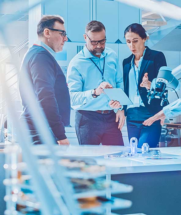 Manufacturing stakeholders meeting around a table