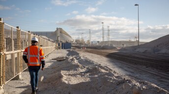 person walking through a mine site