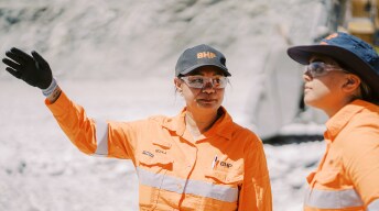 people chatting on a mine site