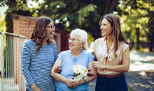 older woman walking with younger women