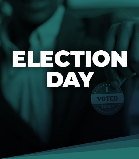 The words ELECTION DAY over a dark blue and green tinted photo of a man holding a 