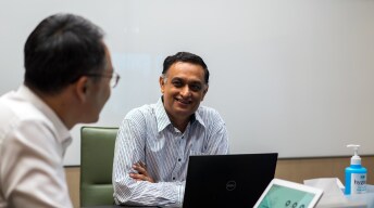 people talking in a meeting room