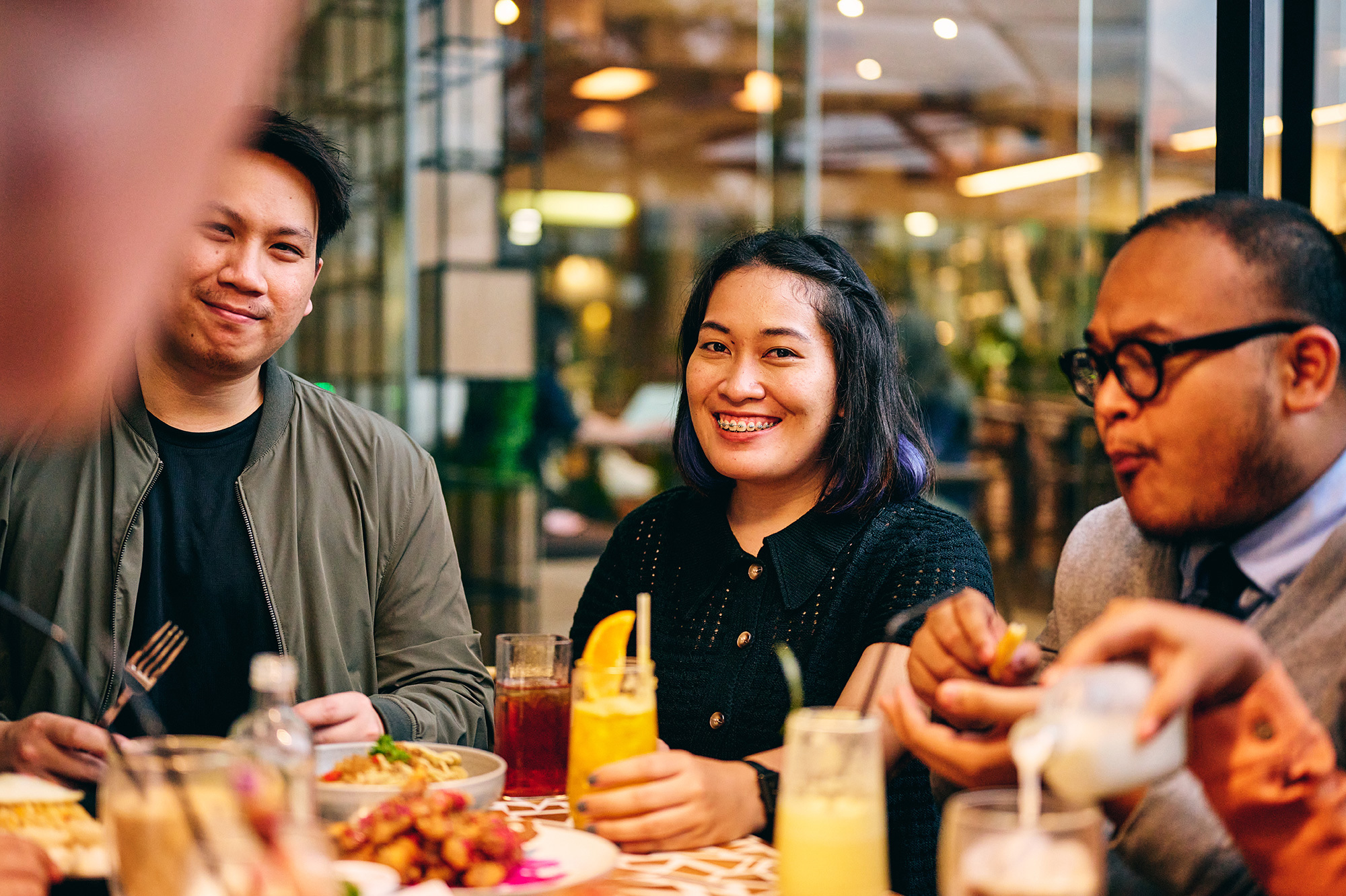 a group of people sitting at a table