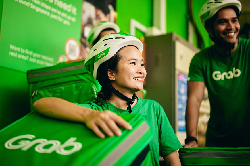 a woman wearing green shirts and white helmets