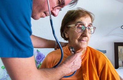 Provider checking patients heart 