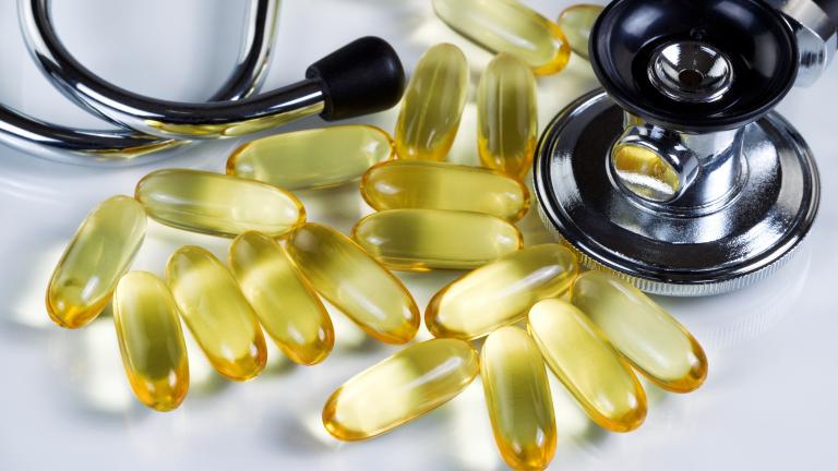 Photo of fish oil capsules next to stethoscope. Source: Shutterstock