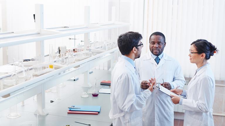 scientists talking in lab