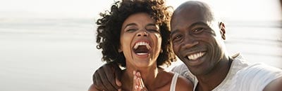 Happy couple outdoors in the sun