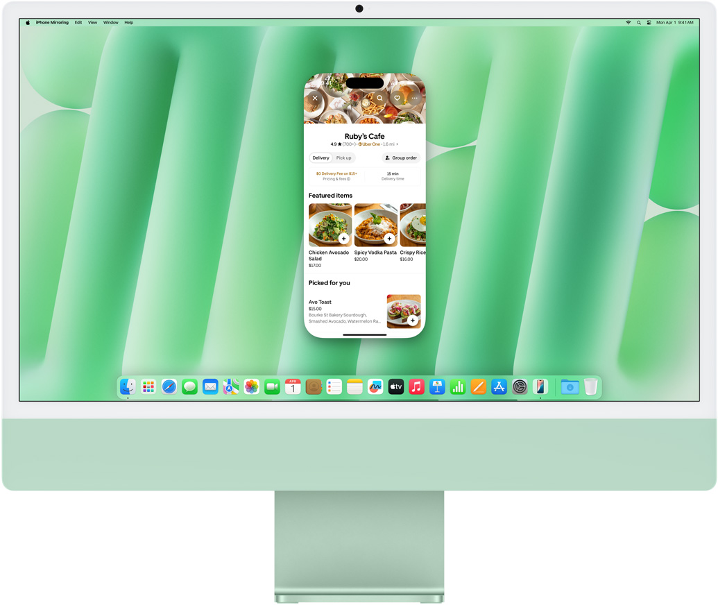 iPhone 鏡像輸出功能展示。顯示 Uber Eats app 的 iPhone 螢幕，在 iMac 上鏡像輸出和控制。