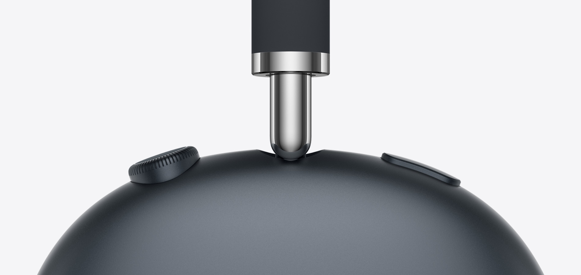 A close-up of the side of AirPods Max in Midnight colour.