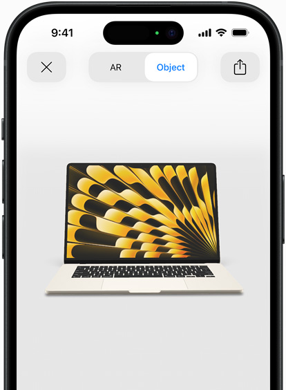 Preview of MacBook Air in Starlight colour being viewed in AR experience on iPhone