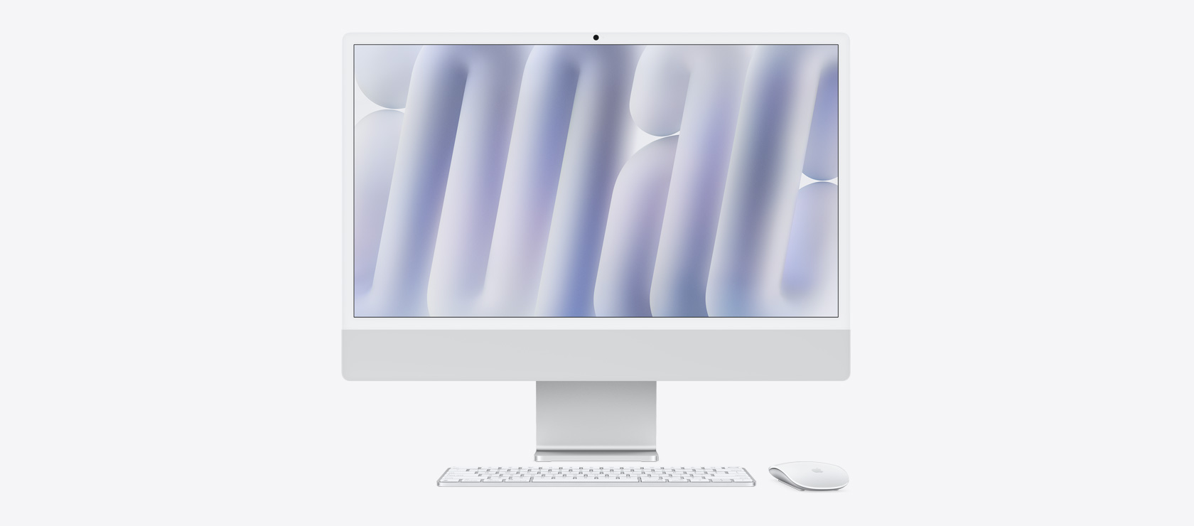 银色 iMac 配同色系鼠标和键盘的正面视图