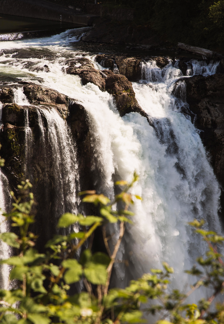 A Large Waterfall Over Some Water