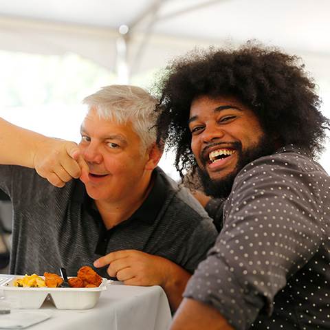 Jimmy and Rodell bond over food and laughs at a company-wide get-together.