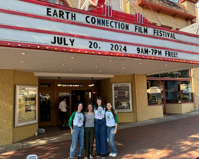 Festival director Sarah Lasley, winning film-maker Denise Dragiewicz, festival director & PI Jessica Eise, festival coordinator Amanda Camarillo pose outside the Buskirk-Chumley Theatre in Bloomington, Indiana.