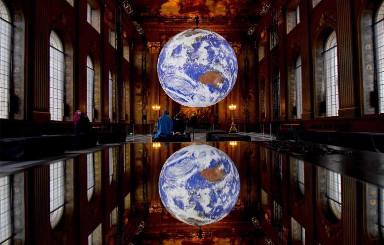 The Painted Hall Old Royal Naval College Greenwich London UK. GAIA by artist Luke Jerram.