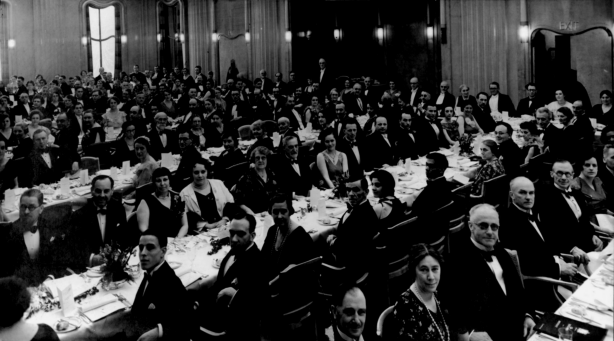 Black and white photo of guests seated at the RA dinner