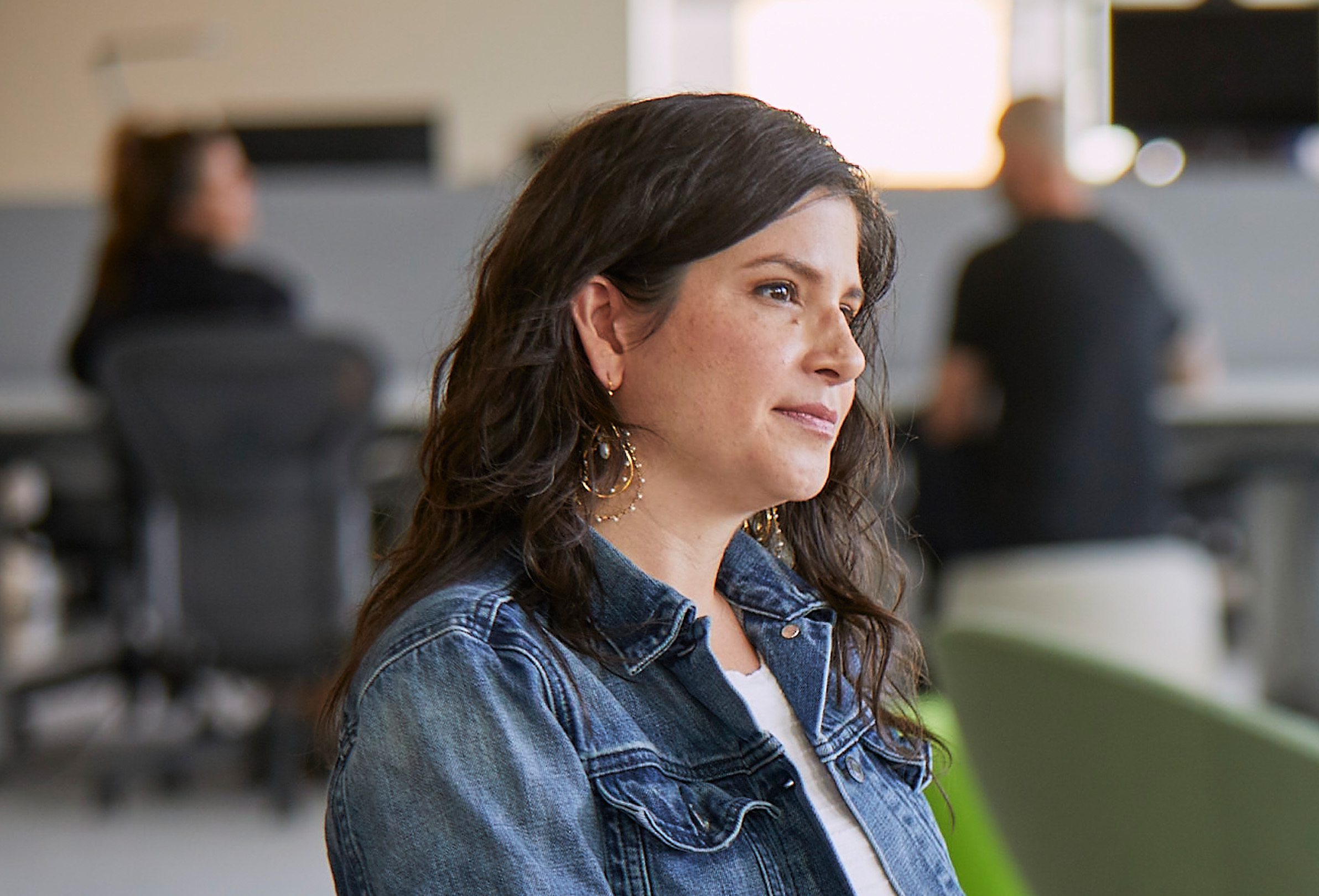 An Apple employee listening while in a meeting.