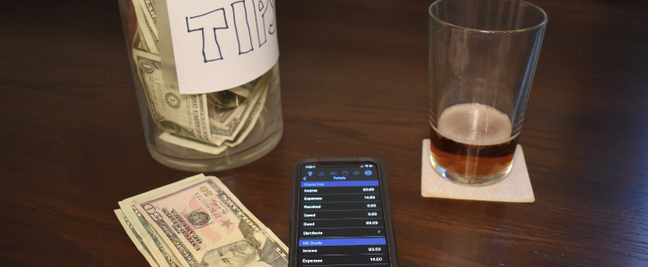 pub table with tip jar