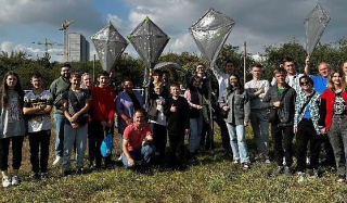 Children in Ukraine learn aerodynamics and teamwork, and experience the joy of flying their own kites during event.