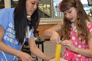 A teacher and student work together.