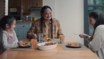 A family eating in their kitchen