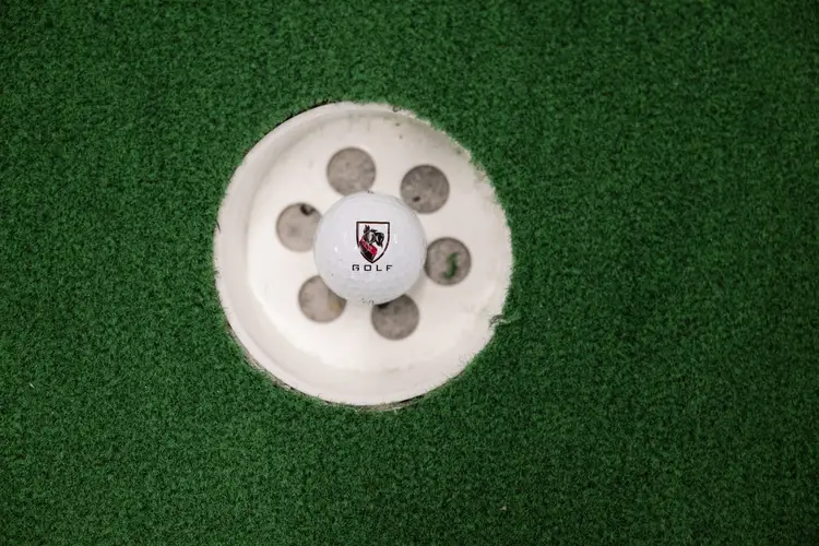 A CMU golf ball in a hole. 