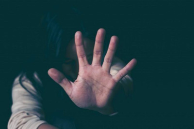 photo of a woman holding out her hand to signal stop