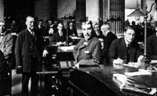 This image is in black and white and shows a group of people in a banking hall. The image is from the NatWest Group archive. 