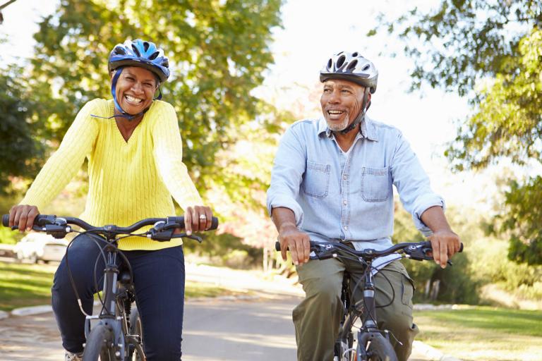 Senior couple bicycling.