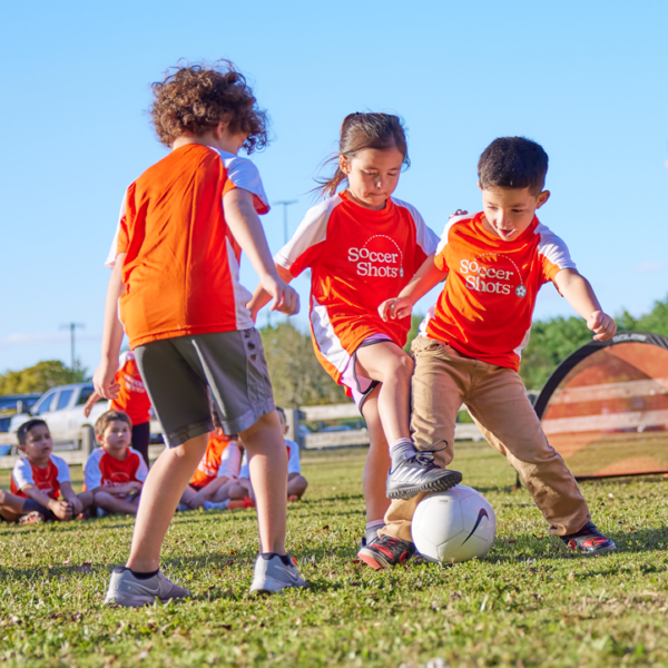 Soccer Shots Premier age playing soccer