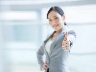 Woman showing "thumbs up".