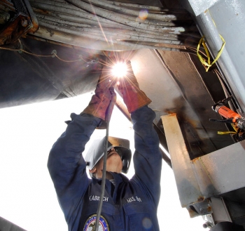 A US Navy welder works at the Puget Sound Naval Shipyard. Photo courtesy US Navy