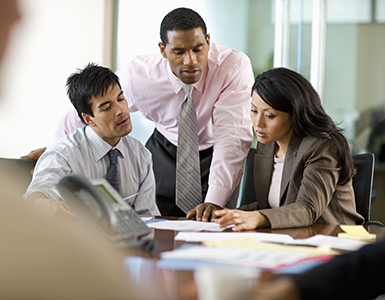 Three people working