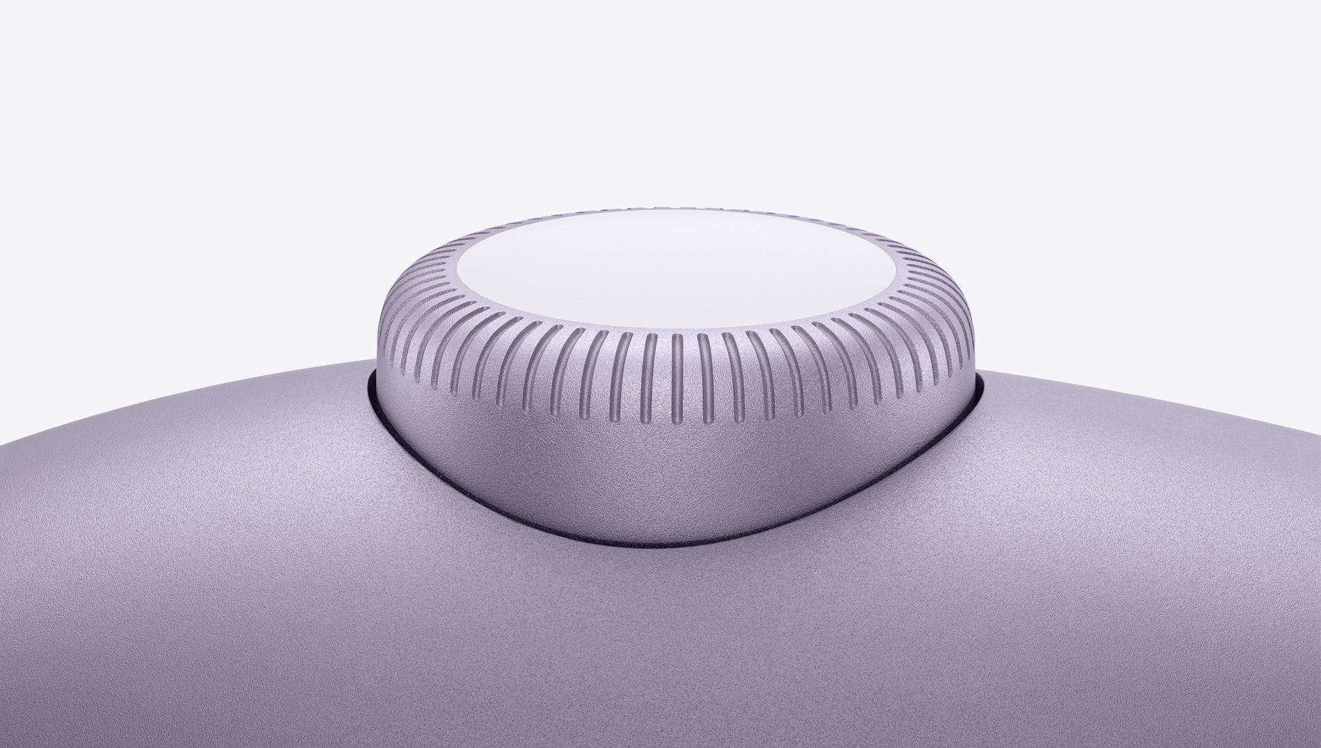 Detailný záber na korunku Digital Crown slúchadiel AirPods Max vo fialovej farbe.