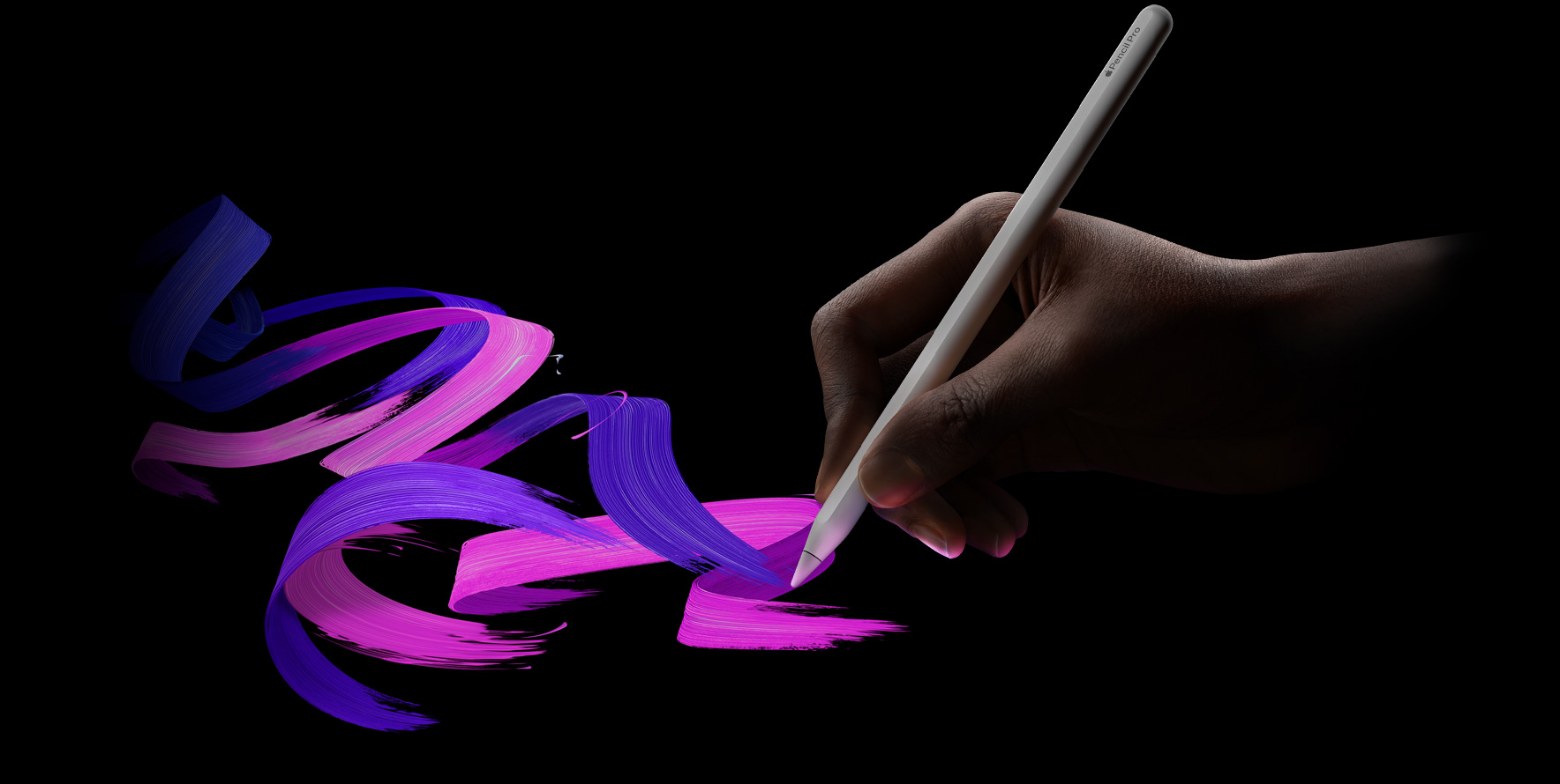 Kasutaja hoiab käes Apple Pencil Prod ning tõmbab kirka pintslijoone