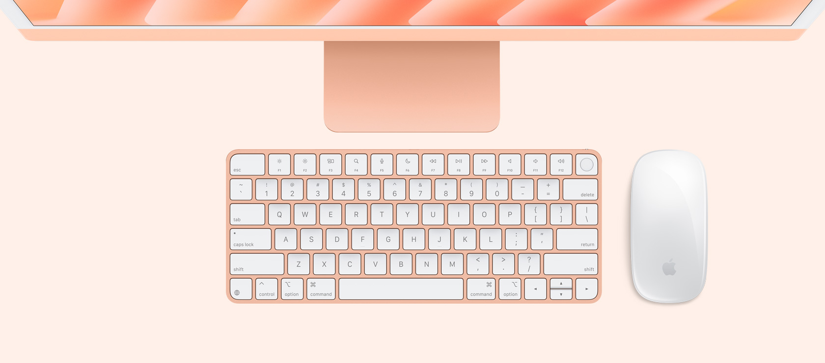 Overhead view of orange iMac with color-matching mouse and keyboard