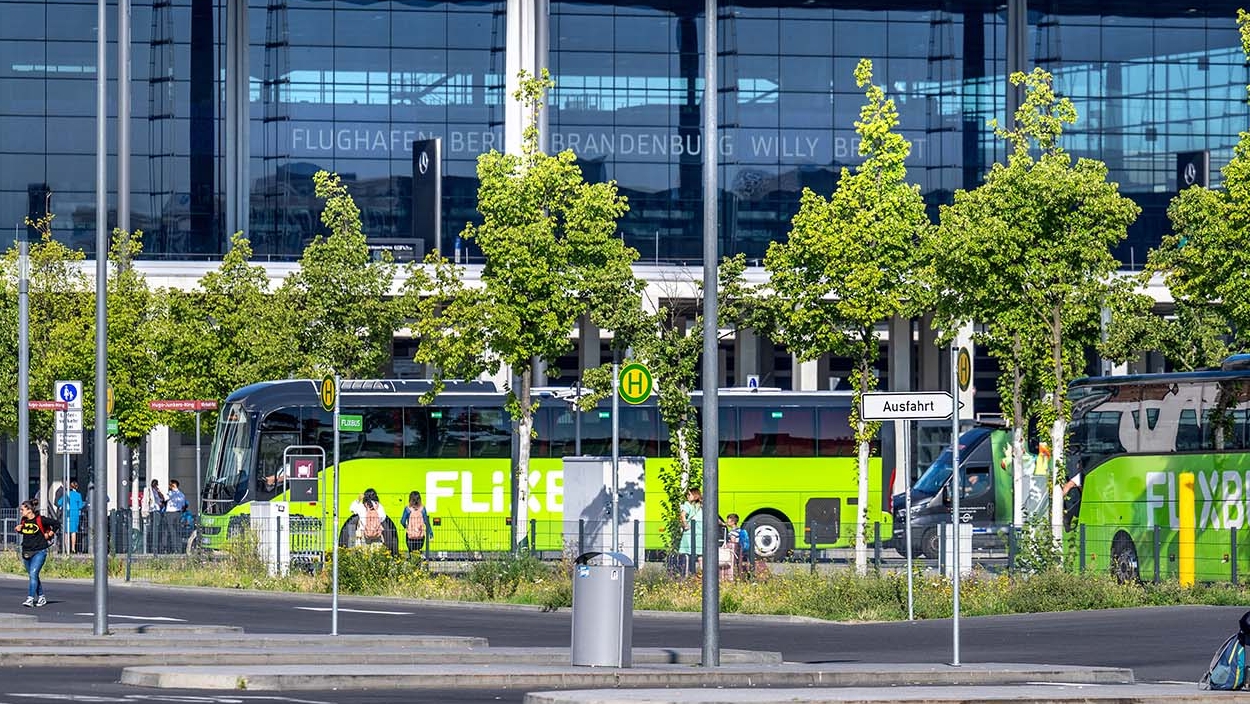 View of long-distance buses, with Terminal 1 behind them.