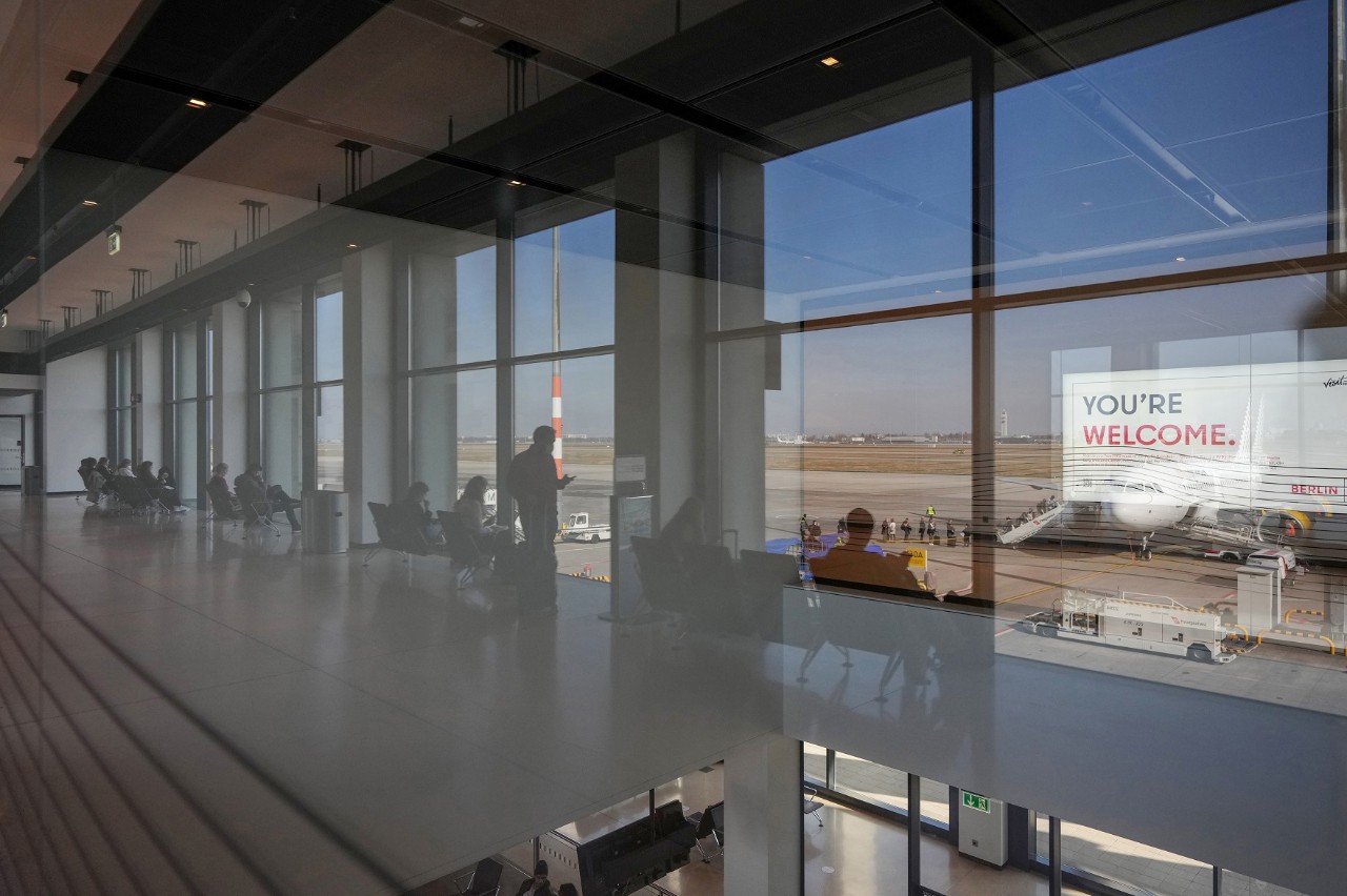 Passengers wait in the gate area of Terminal 2