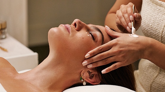 photo of woman receiving facial at the skin longevity experience