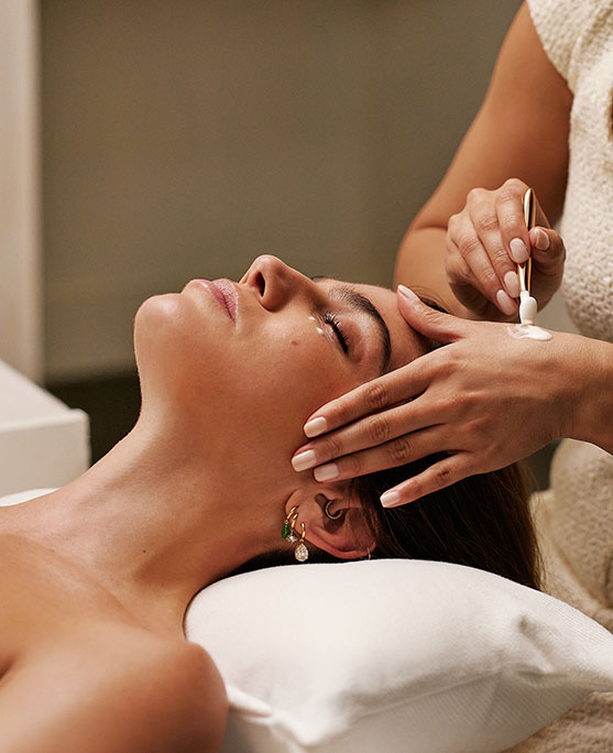 photo of woman receiving facial at the skin longevity experience