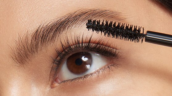 photo of woman showing how to apply mascara