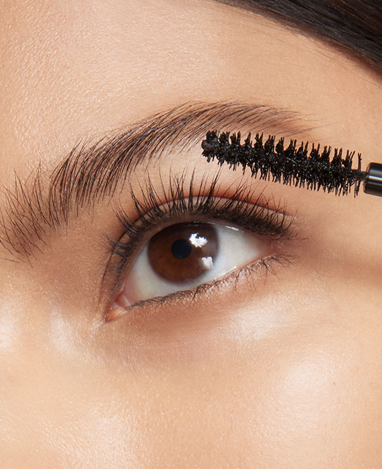 photo of woman showing how to apply mascara