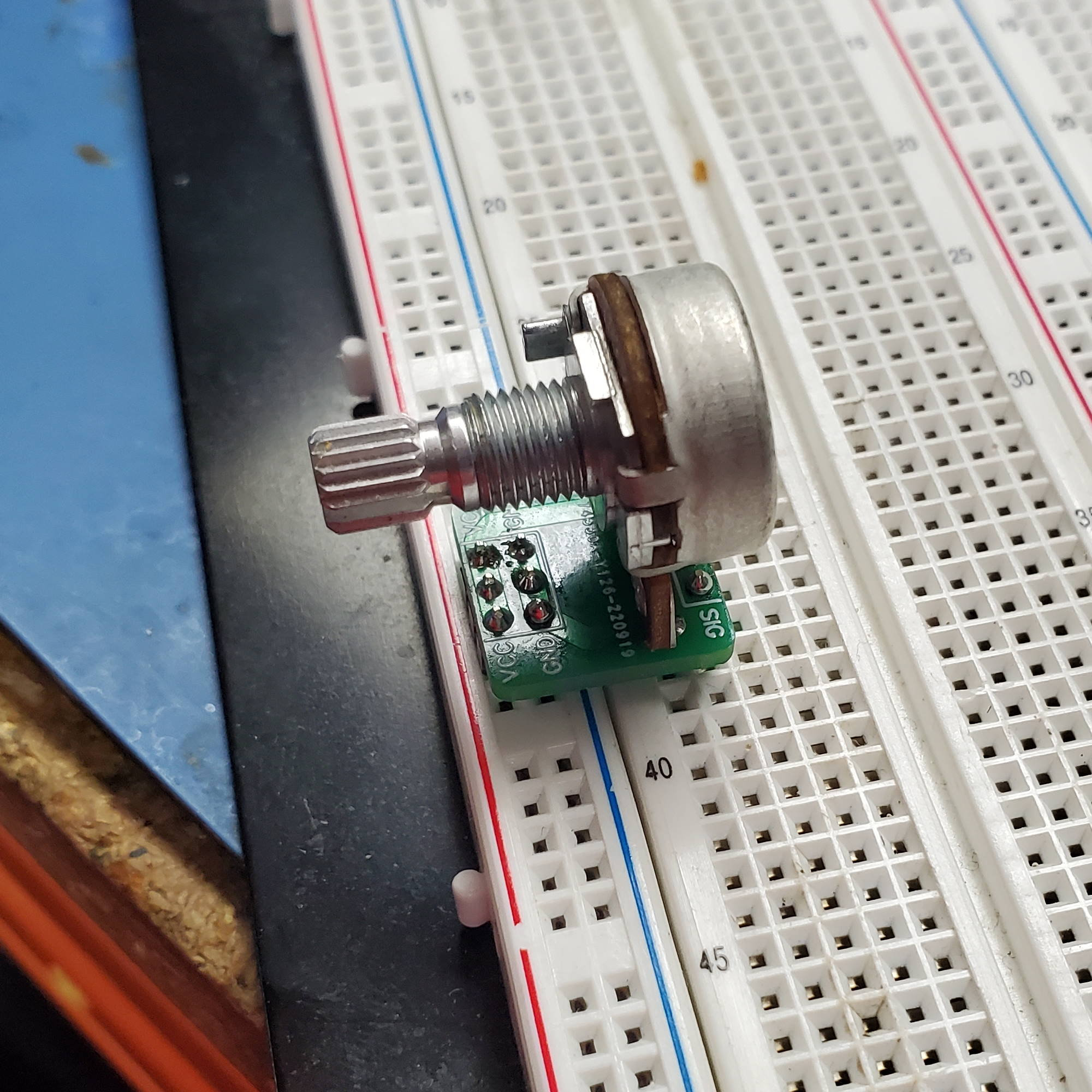 Photo of assembled board sitting in a breadboard