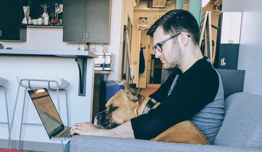 banner image where I am writing code with my dog