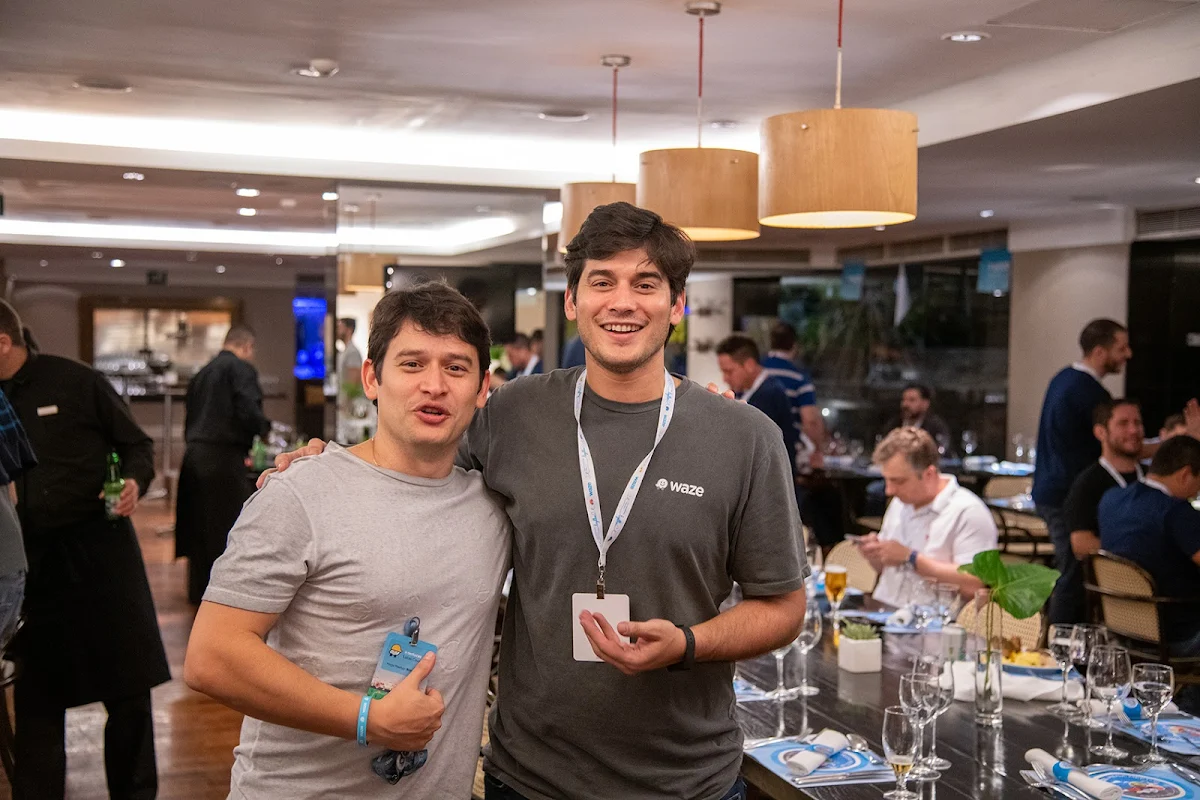 Two mean wearing lanyards facing the camera