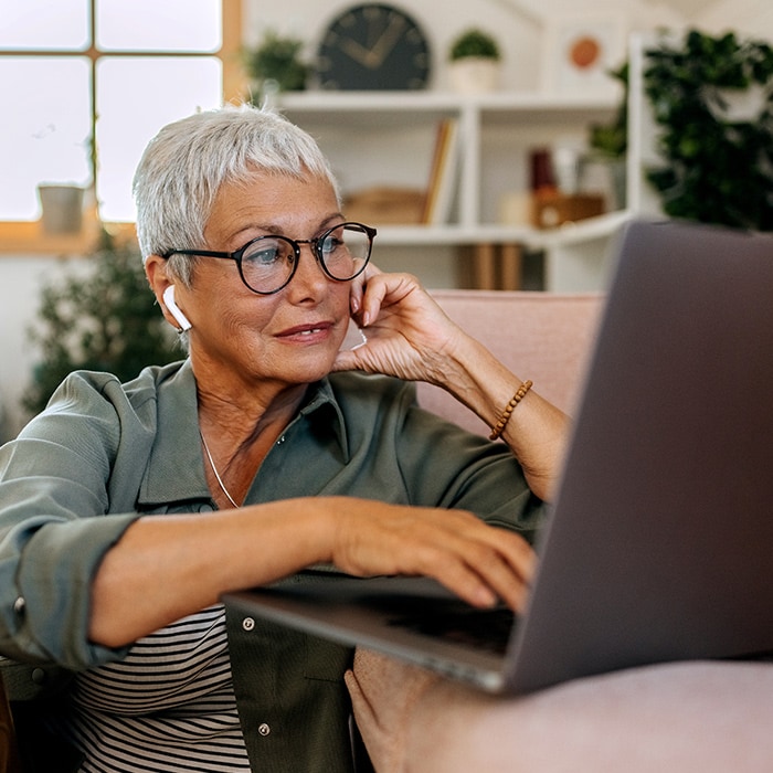 A person learns how to check their FICO score on their computer.