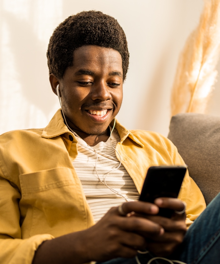 A man checks his Snapchat on his phone. 