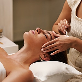 photo of woman receiving facial at the skin longevity experience